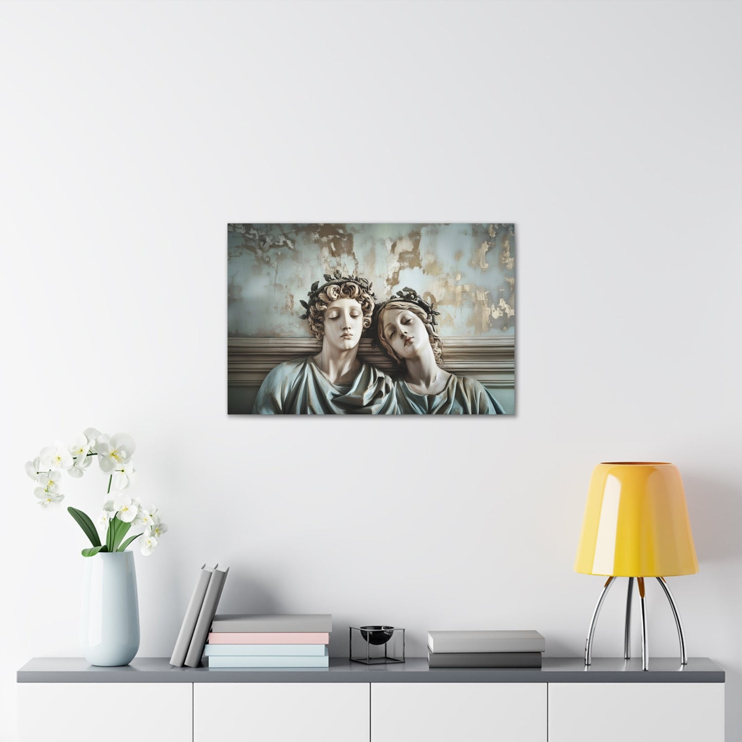 Horizontal-oriented wall art: "Tranquil Companions" Two classical statues, rest their heads against each other with eyes closed, evoking a serene sense of companionship. The weathered background with soft pastel tones and hints of gold adds to the tranquil, nostalgic ambiance of the artwork.