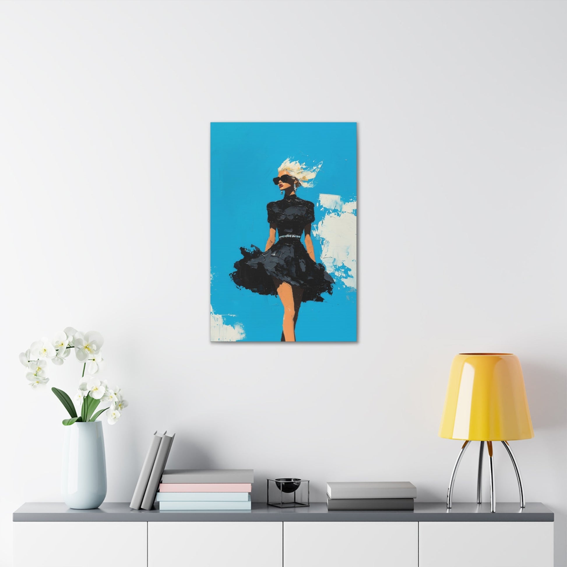 Vertical-oriented wall art: "Black Enigma II." A confident woman walks gracefully in a textured black dress, her wind-blown hair illuminated against a vibrant cerulean sky. The bold palette knife technique and striking contrasts emphasize empowerment and elegance.