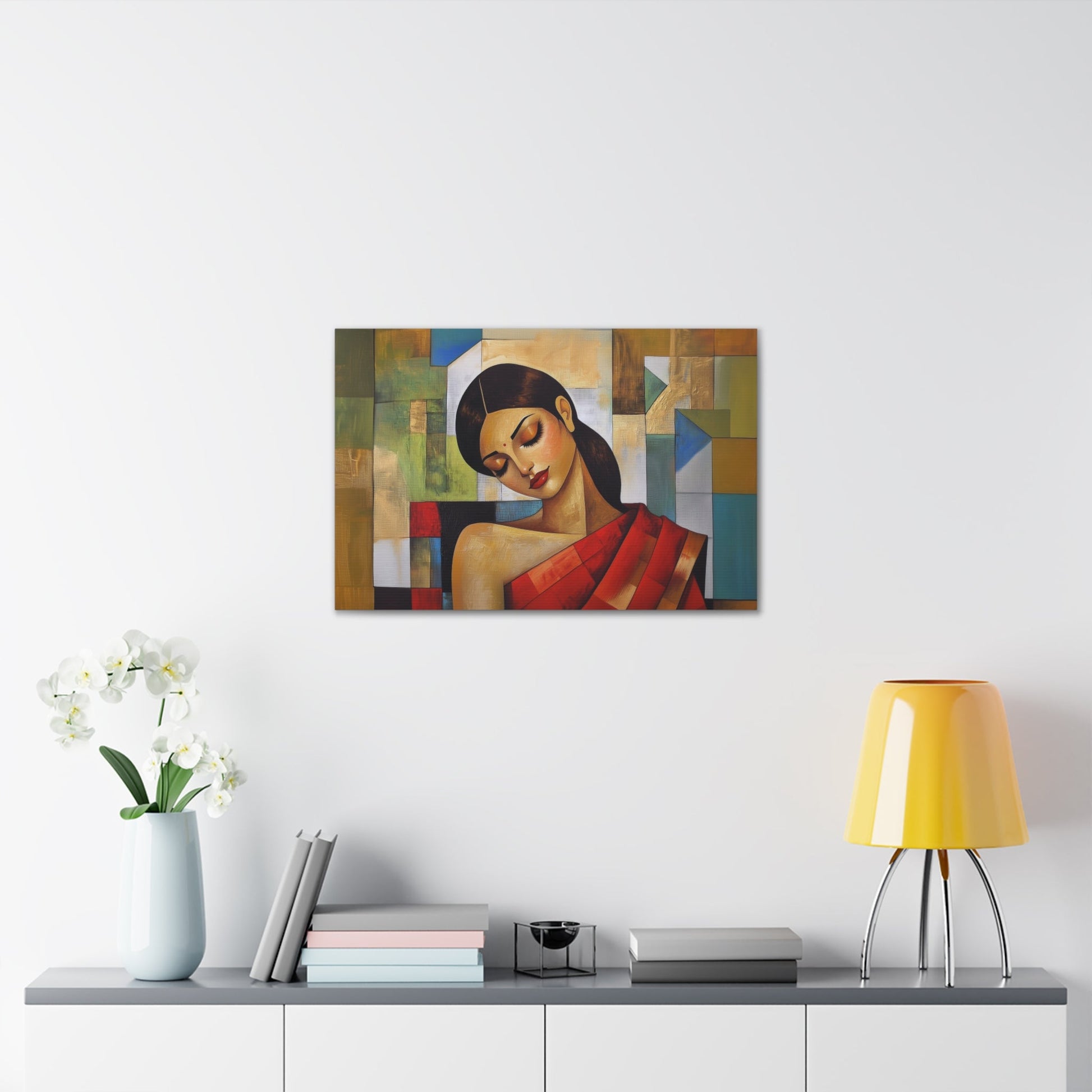 Horizontal-oriented wall art: "Fractured Grace." An Indian woman in traditional attire is depicted in a Cubist style, her contemplative expression framed by geometric shapes and bold colors of red, green, and gold. The textured background and soft dramatic lighting create an elegant and serene composition.