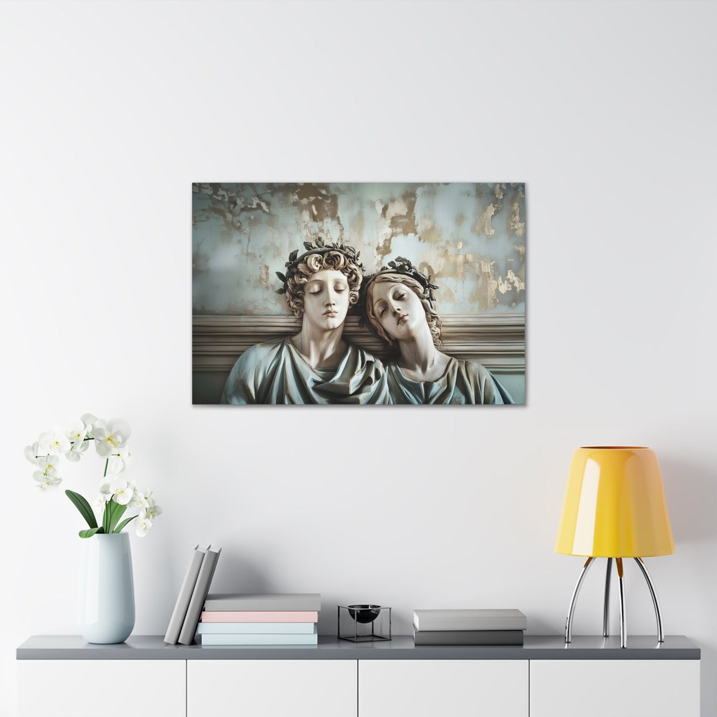 Horizontal-oriented wall art: "Tranquil Companions" Two classical statues, rest their heads against each other with eyes closed, evoking a serene sense of companionship. The weathered background with soft pastel tones and hints of gold adds to the tranquil, nostalgic ambiance of the artwork.