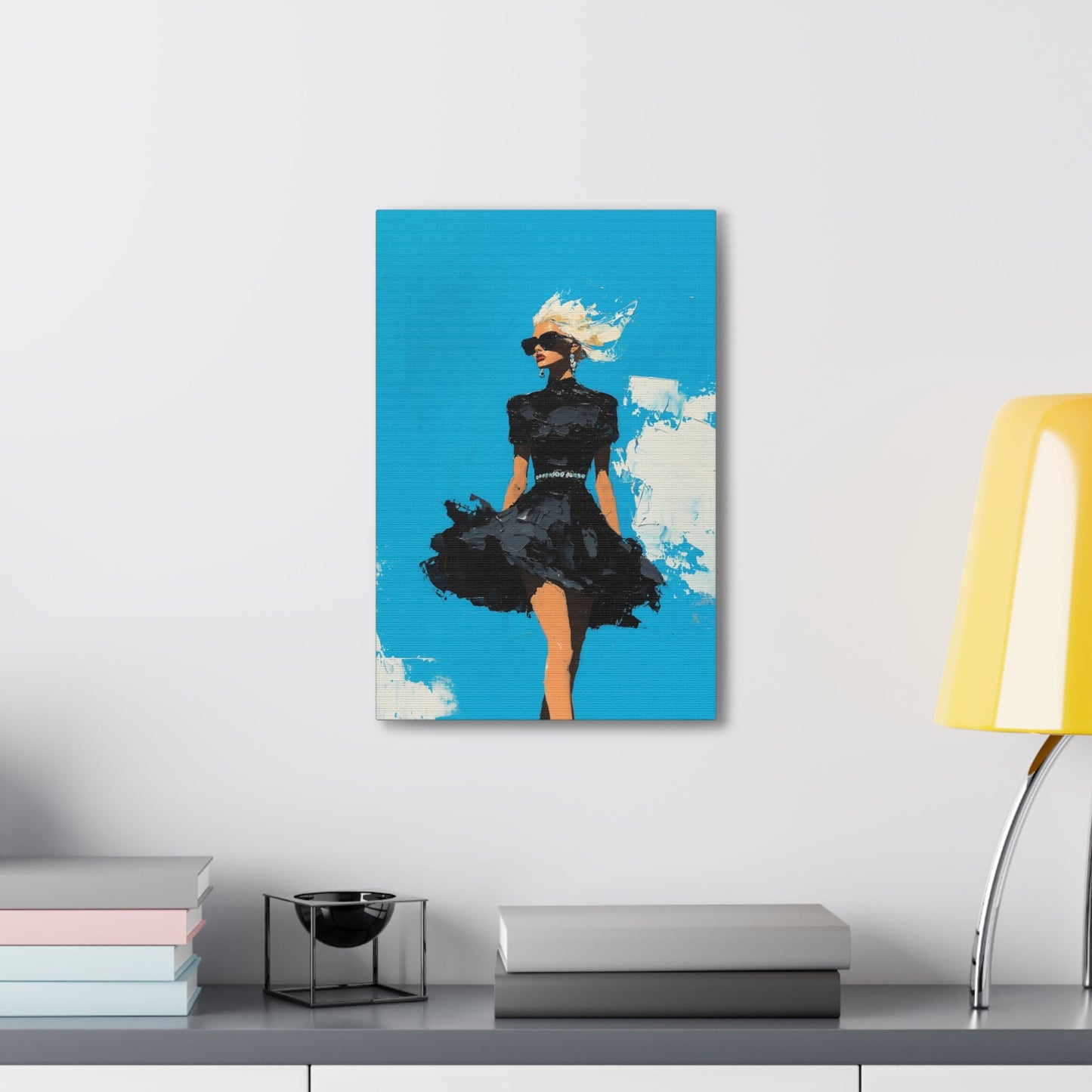 Vertical-oriented wall art: "Black Enigma II." A confident woman walks gracefully in a textured black dress, her wind-blown hair illuminated against a vibrant cerulean sky. The bold palette knife technique and striking contrasts emphasize empowerment and elegance.