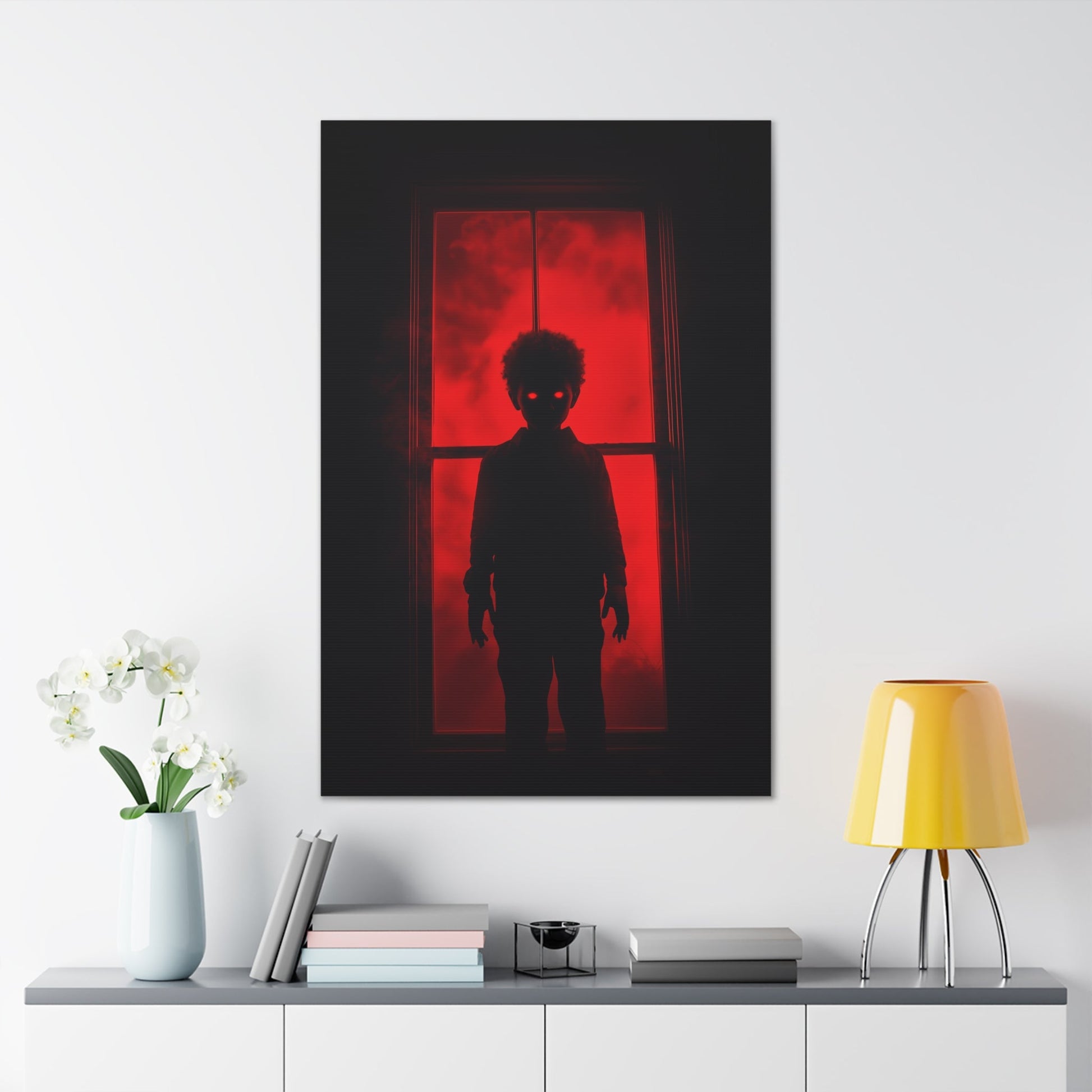 Vertical-oriented wall art: "Shadows in the Mist II." A shadowy child-like figure with glowing red eyes stands against a crimson-illuminated window, shrouded in red mist and black silhouettes, evoking an eerie and supernatural atmosphere.