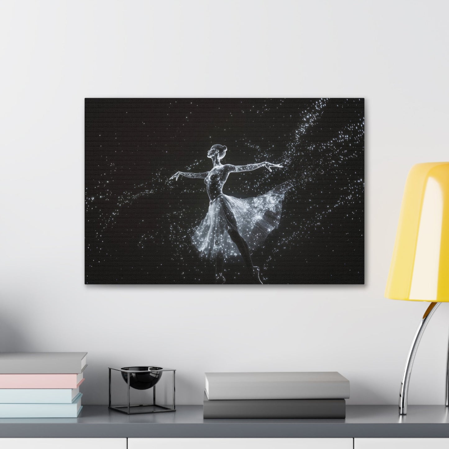 Horizontal-oriented wall art: "Cosmic Ballet III" A ballerina made of radiant, star-like dots gracefully dances against a dark, star-filled backdrop, her silhouette shining in monochromatic light. The scene captures the ethereal beauty of a cosmic dance, with stars trailing from her flowing skirt.