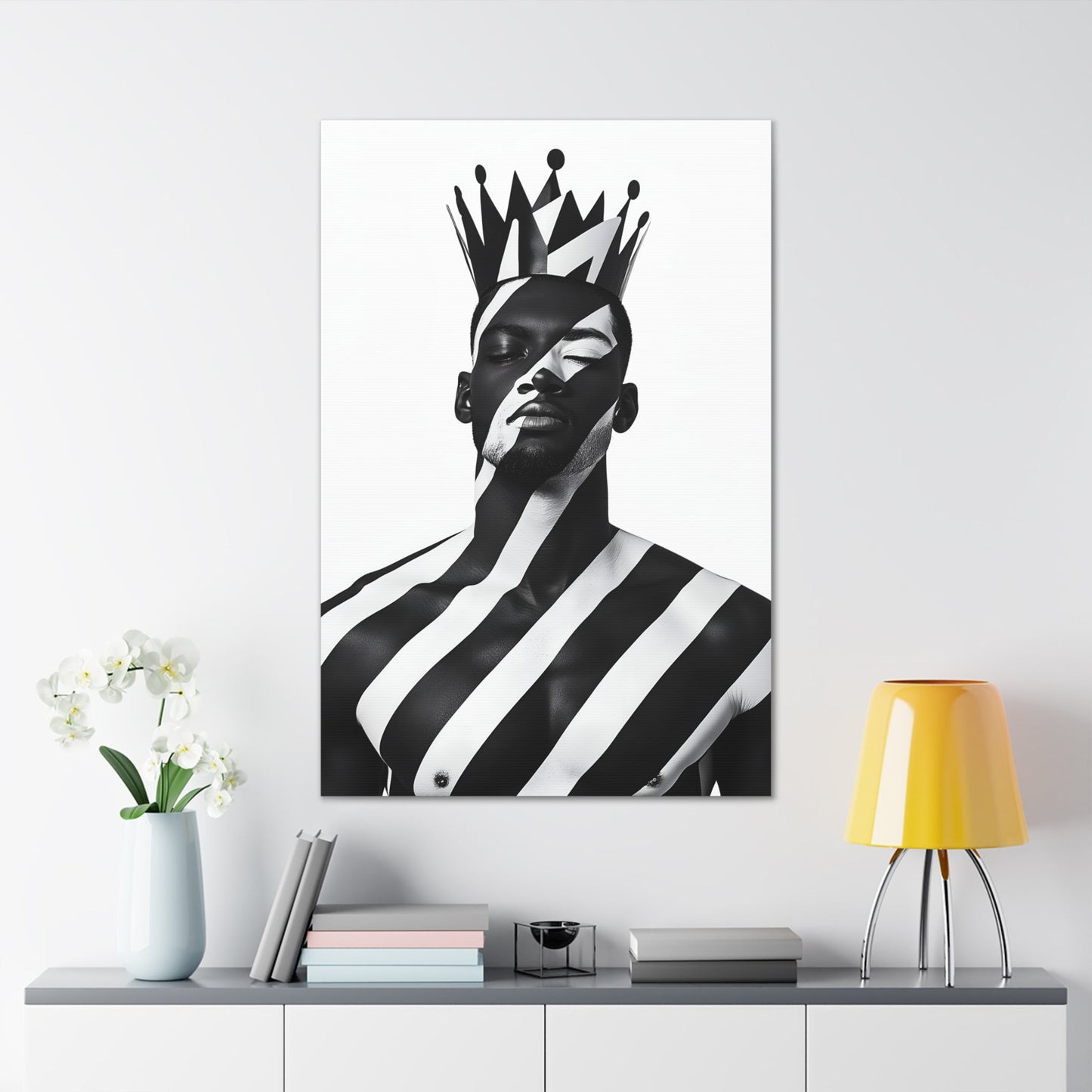 Vertical-oriented wall art: "Crown of Dignity II" A regal portrait of a man wearing a bold, geometric crown, with black and white stripes painted across his face and body. The minimalist composition emphasizes strength, elegance, and cultural pride in a modern, abstract style.