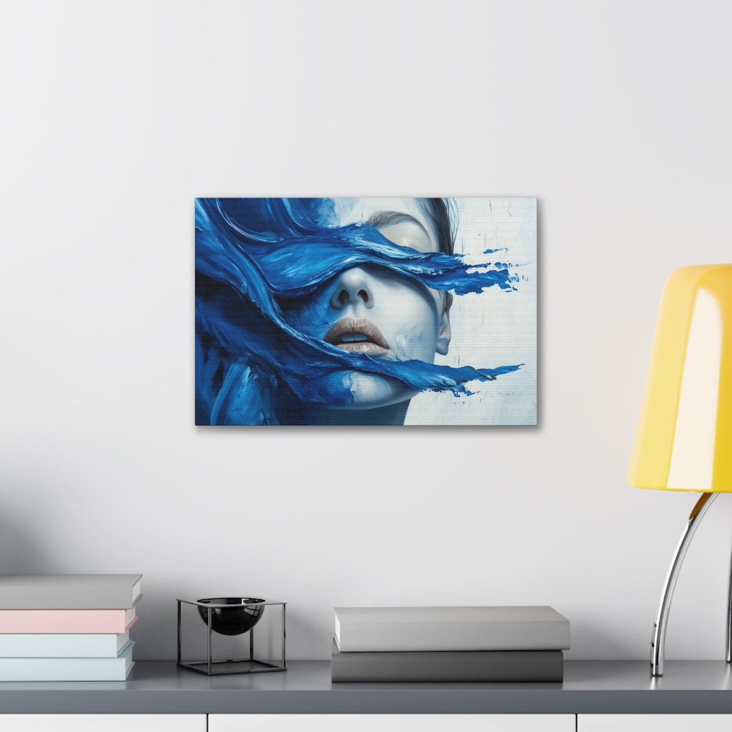 Horizontal-oriented wall art "Tides of the Mind" A surreal portrait of a woman's face partially obscured by flowing waves of cobalt blue paint. The image evokes a sense of introspection and calm, blending realistic features with abstract, fluid movement.