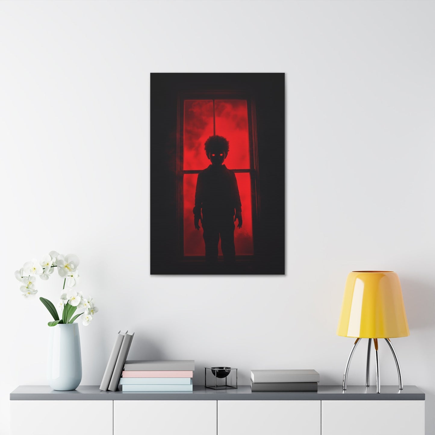 Vertical-oriented wall art: "Shadows in the Mist II." A shadowy child-like figure with glowing red eyes stands against a crimson-illuminated window, shrouded in red mist and black silhouettes, evoking an eerie and supernatural atmosphere.