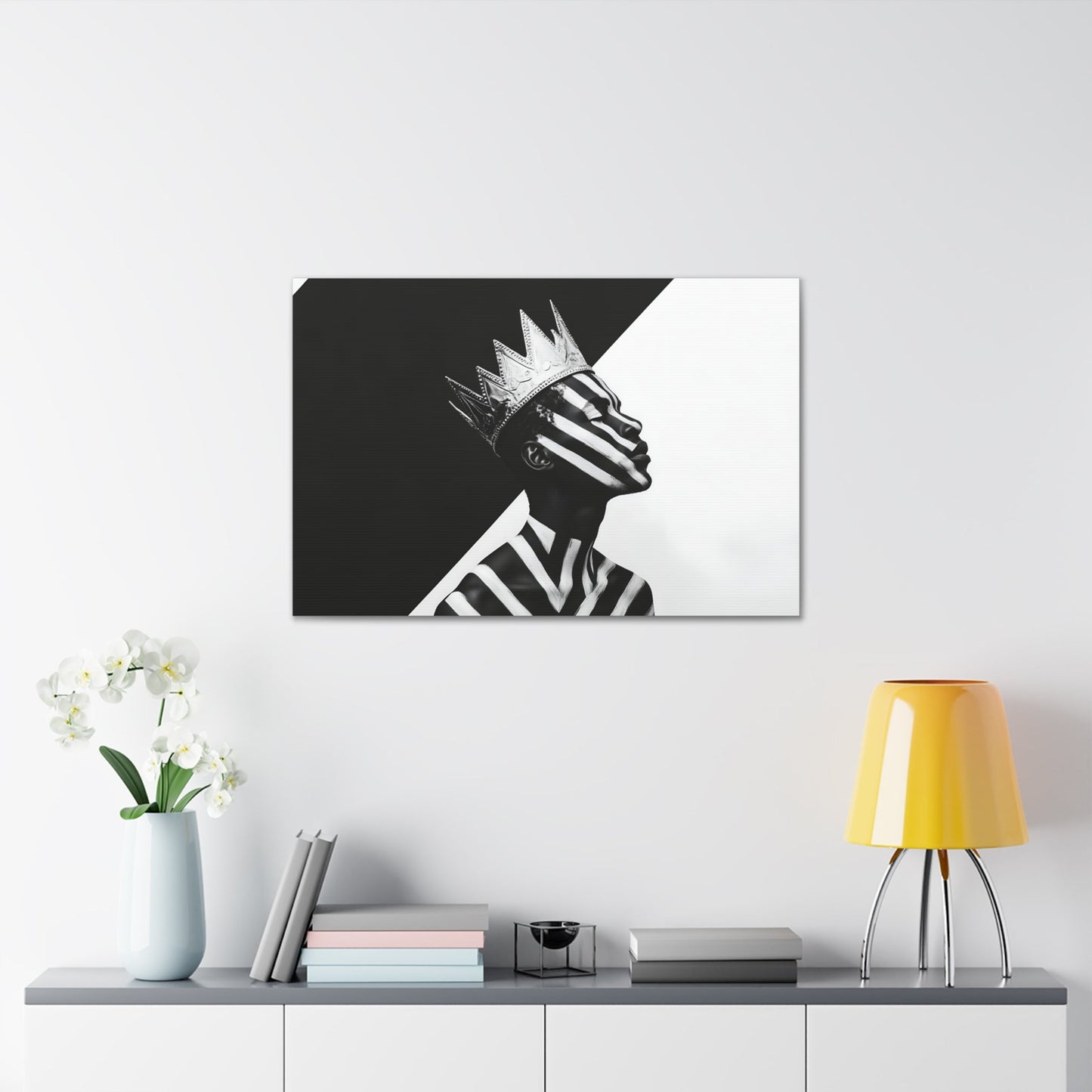 Horizontal-oriented wall art: "Crown of Dignity V" A black-and-white abstract portrait of a Black man wearing a metallic crown, his face and body adorned with bold, geometric stripes. The striking contrast and minimalist design emphasize his regal presence and dignified expression against a stark background.