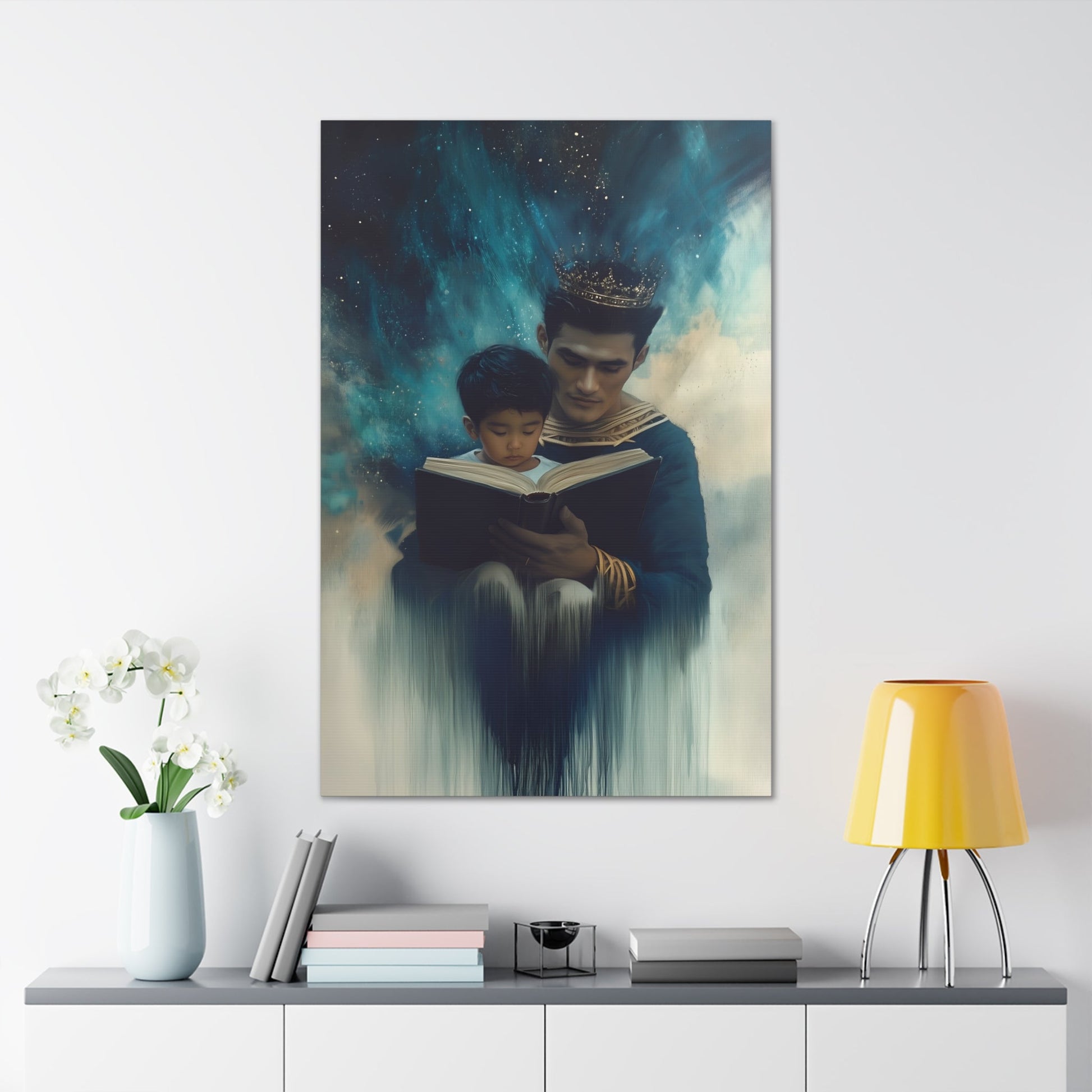 Vertical-oriented wall art: "Crowning Knowledge VI" depicts a father and son wearing golden crowns, reading a book together, surrounded by a swirling, cosmic blue and teal background. The soft, ethereal atmosphere emphasizes the serene and mystical bond of shared learning and wisdom between the two figures.