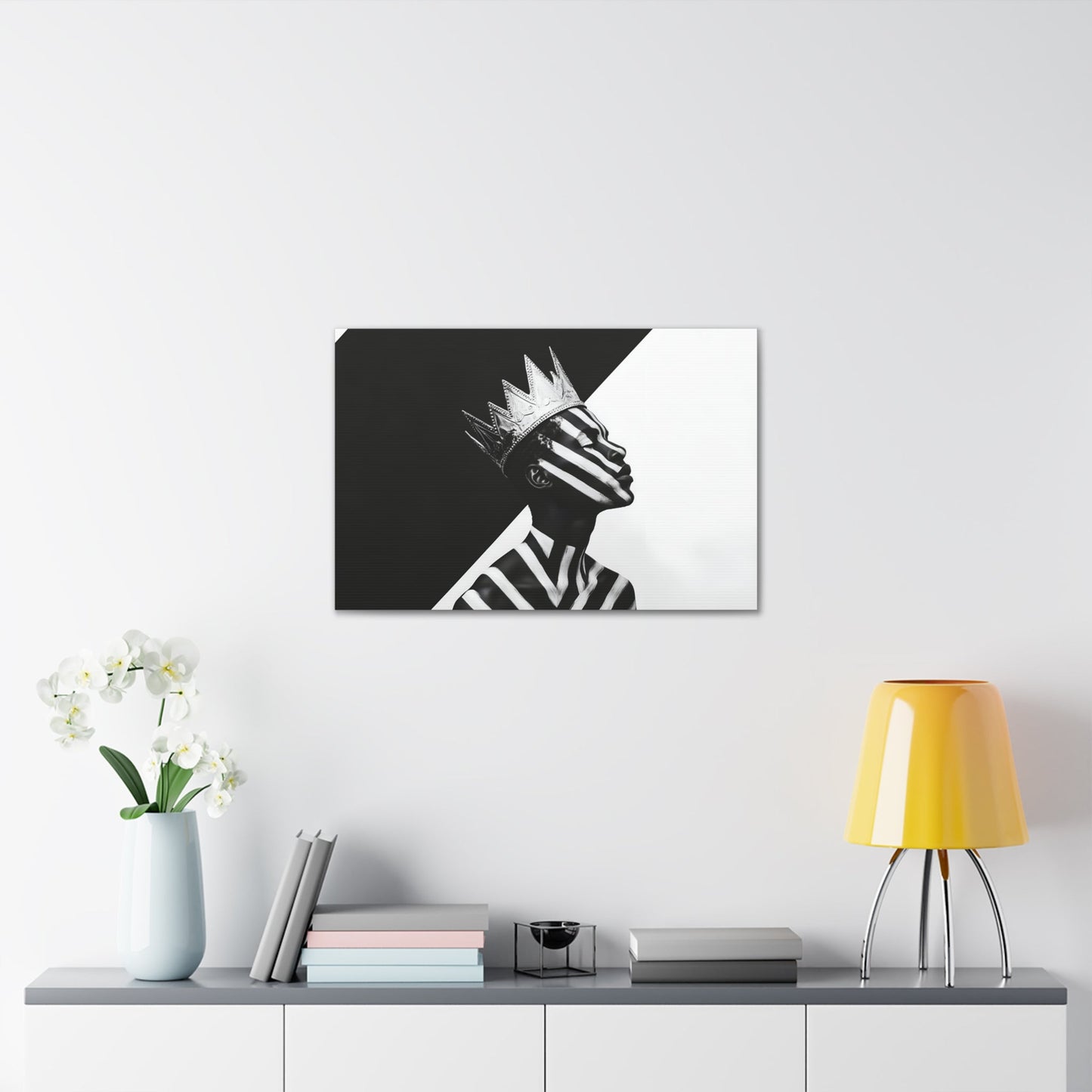 Horizontal-oriented wall art: "Crown of Dignity V" A black-and-white abstract portrait of a Black man wearing a metallic crown, his face and body adorned with bold, geometric stripes. The striking contrast and minimalist design emphasize his regal presence and dignified expression against a stark background.