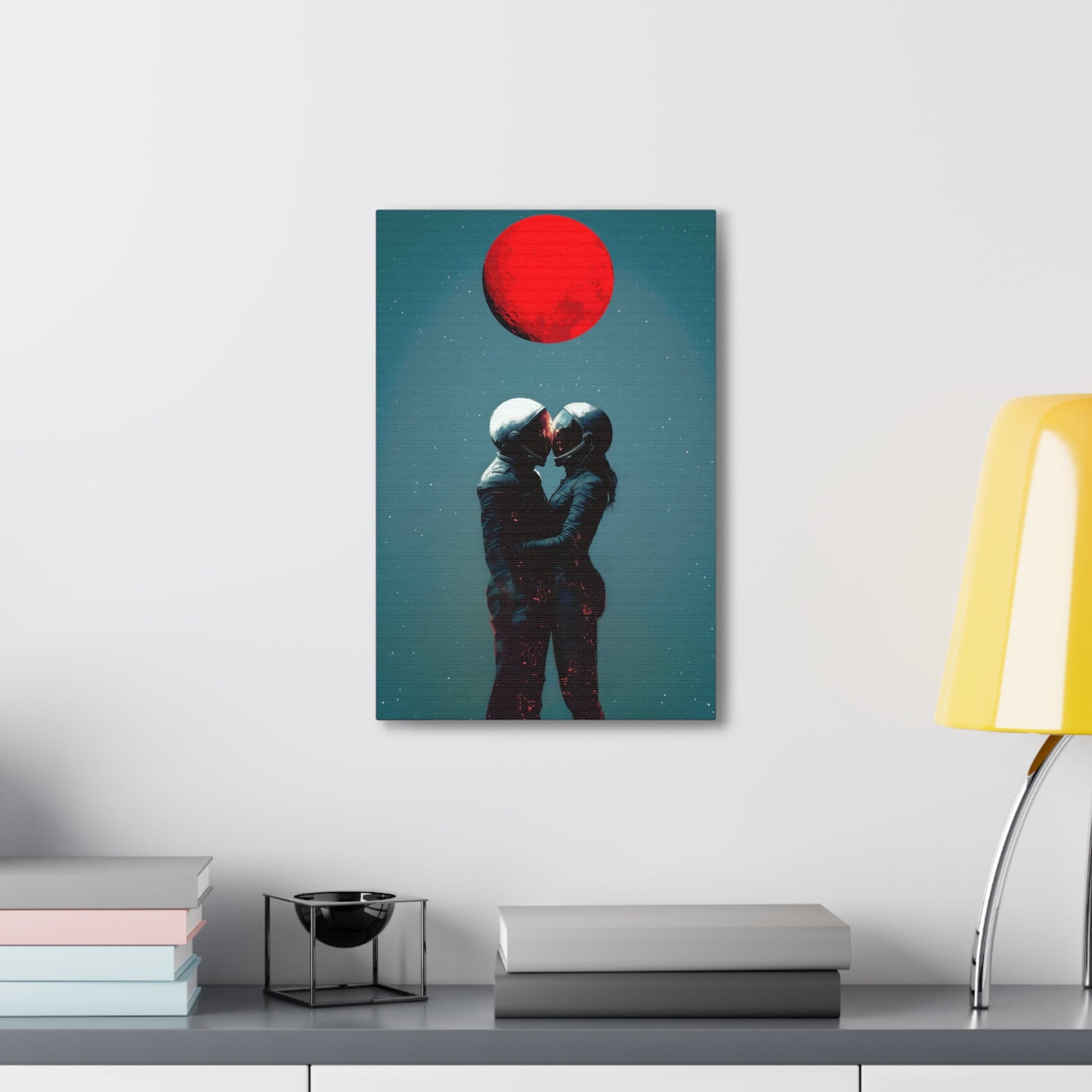 Vertical-oriented wall art: "Galactic Romance IV" depicts two astronauts embracing under a glowing red moon, their helmets gently touching as they share a moment of intimacy in space. The starry background contrasts with the fiery red moon, emphasizing the romantic and cosmic connection between the figures.