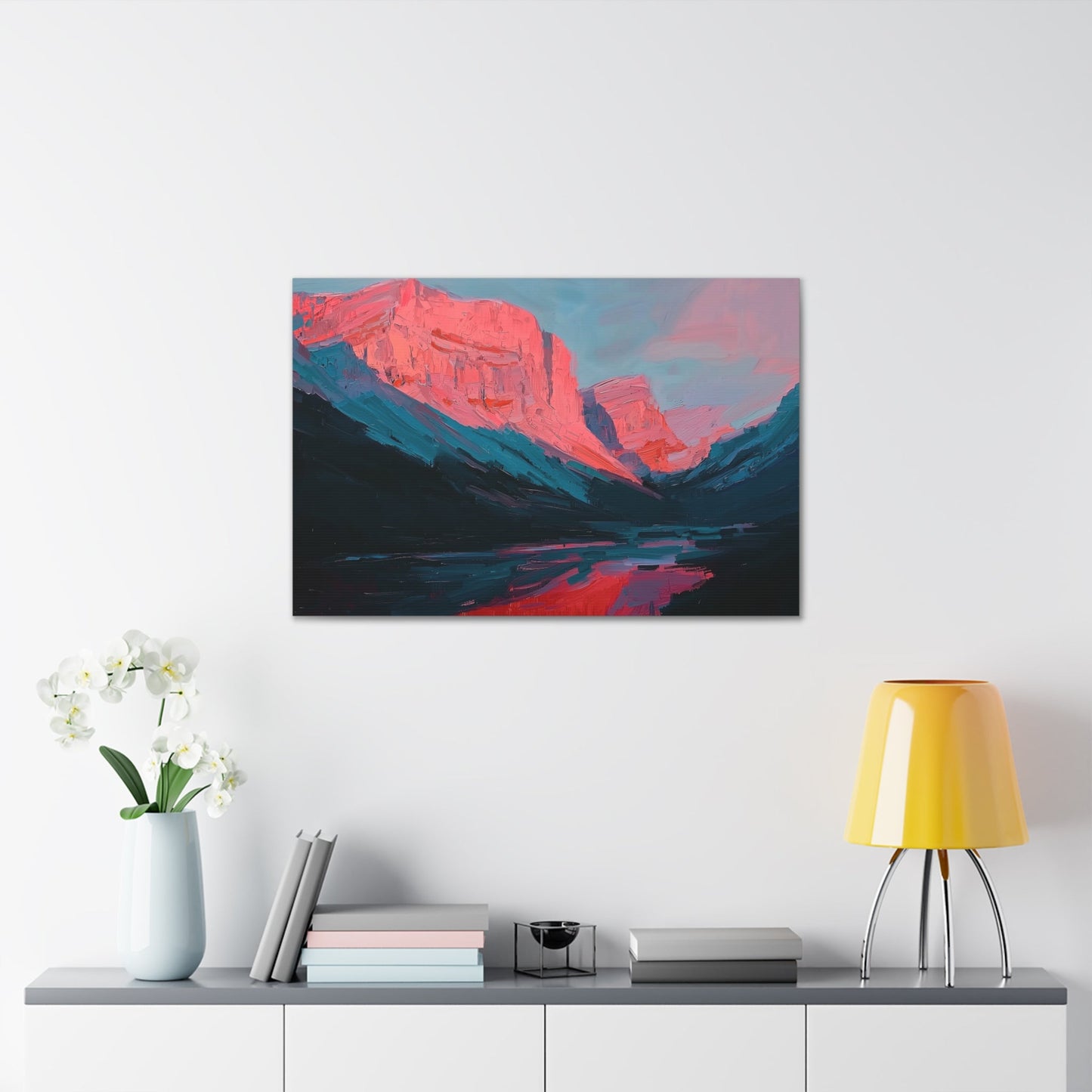 Horizontal-oriented wall art: "Timeless Peaks" Landscape artwork titled Timeless Peaks from the Bold Horizons collection, featuring vibrant crimson and pink mountains reflected in a tranquil lake. The piece highlights bold brushstrokes and a dynamic interplay of warm and cool colors, evoking majesty and serenity.