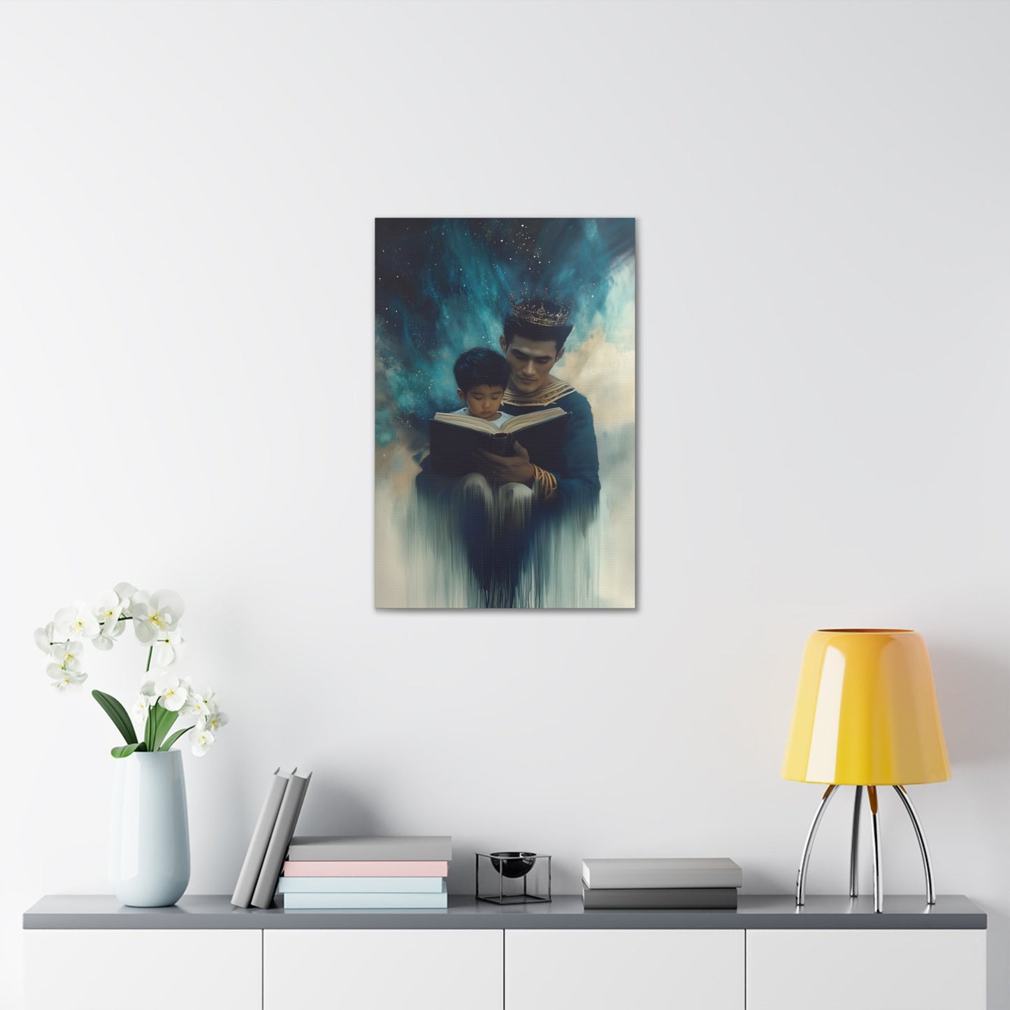 Vertical-oriented wall art: "Crowning Knowledge VI" depicts a father and son wearing golden crowns, reading a book together, surrounded by a swirling, cosmic blue and teal background. The soft, ethereal atmosphere emphasizes the serene and mystical bond of shared learning and wisdom between the two figures.