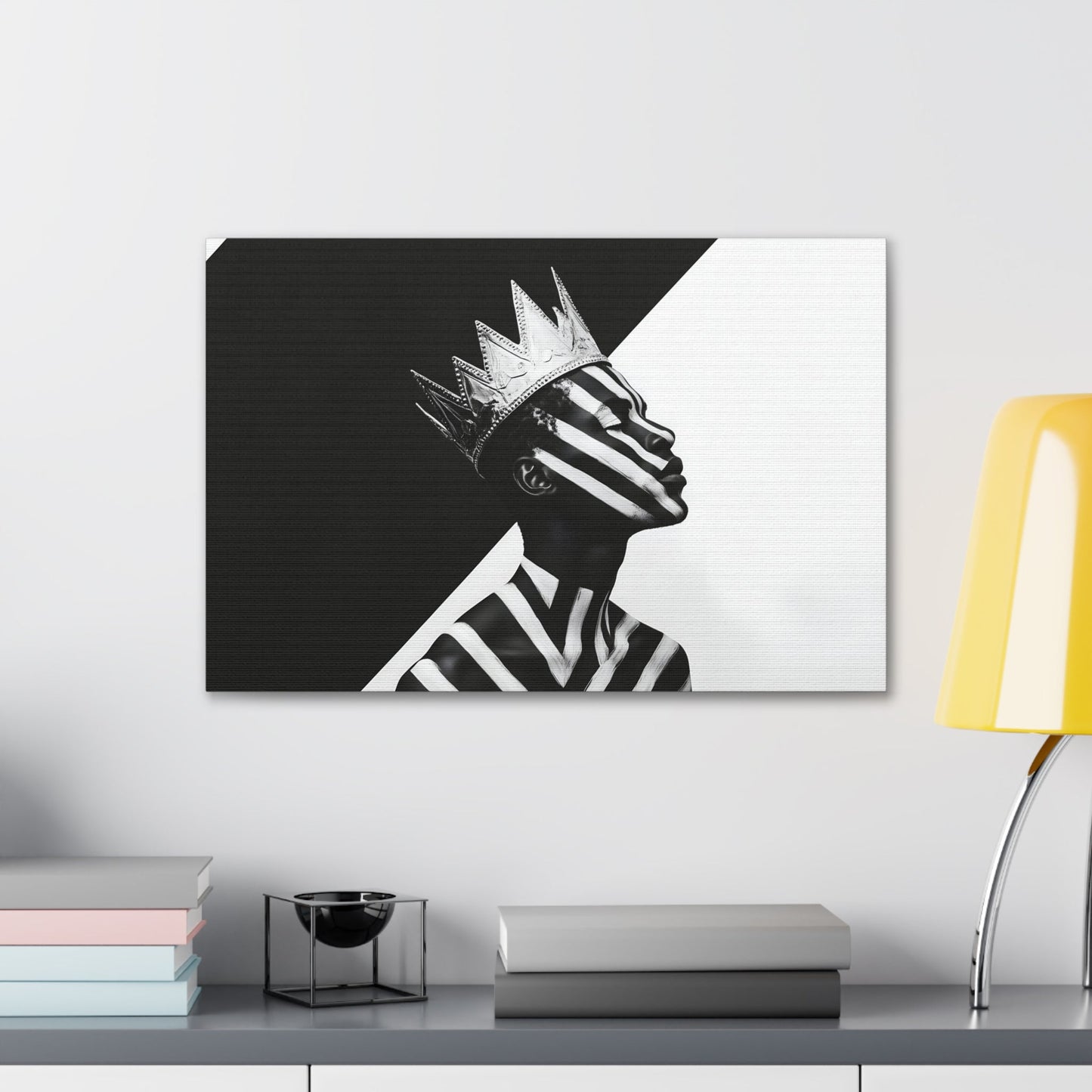 Horizontal-oriented wall art: "Crown of Dignity V" A black-and-white abstract portrait of a Black man wearing a metallic crown, his face and body adorned with bold, geometric stripes. The striking contrast and minimalist design emphasize his regal presence and dignified expression against a stark background.