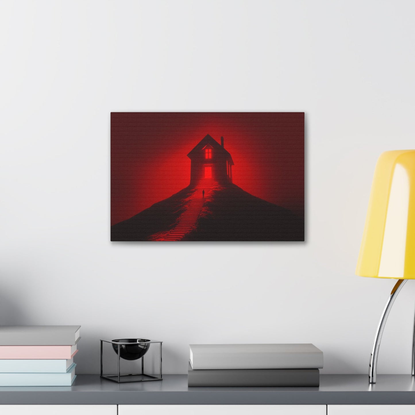 Horizontal-oriented wall art: Artwork titled Crimson Ascent from the Ruby Realms collection, featuring a glowing red house atop a hill with a solitary figure ascending a shadowed staircase. The piece creates an eerie and surreal atmosphere with its intense red glow and dramatic contrast.