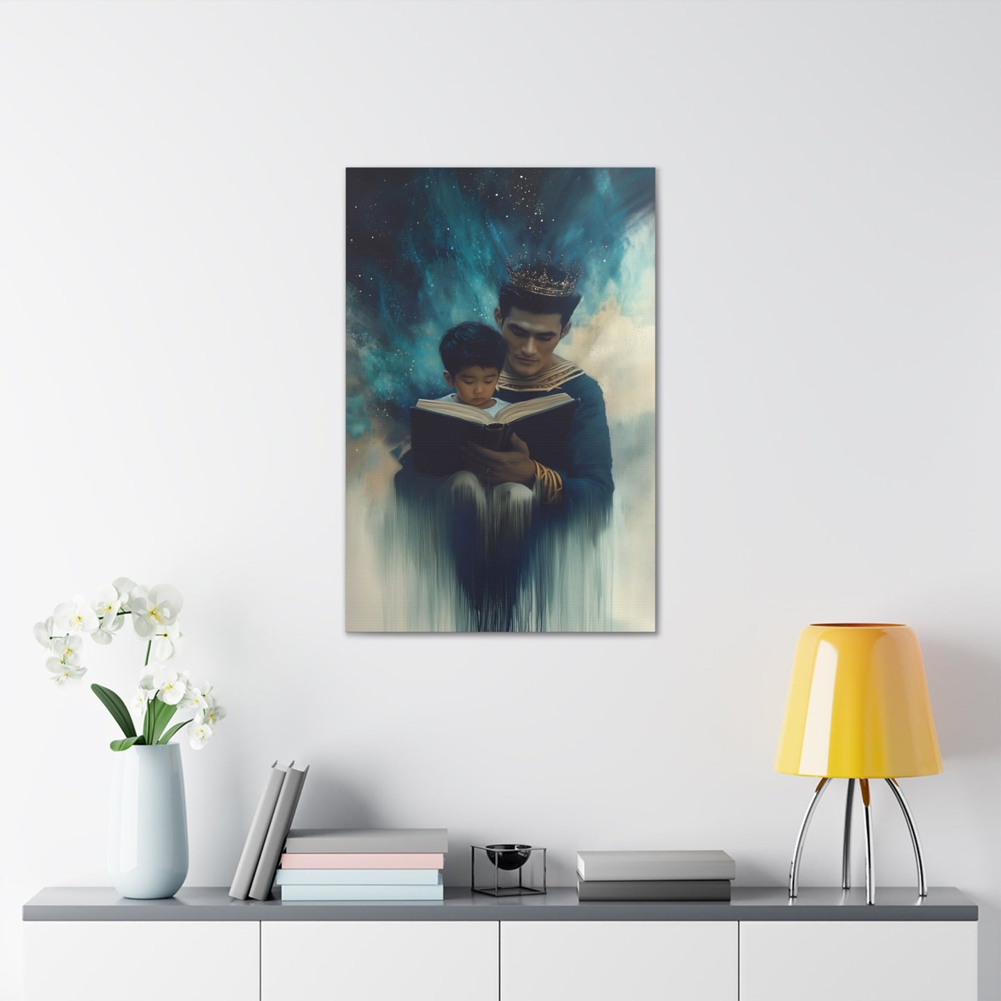 Vertical-oriented wall art: "Crowning Knowledge VI" depicts a father and son wearing golden crowns, reading a book together, surrounded by a swirling, cosmic blue and teal background. The soft, ethereal atmosphere emphasizes the serene and mystical bond of shared learning and wisdom between the two figures.