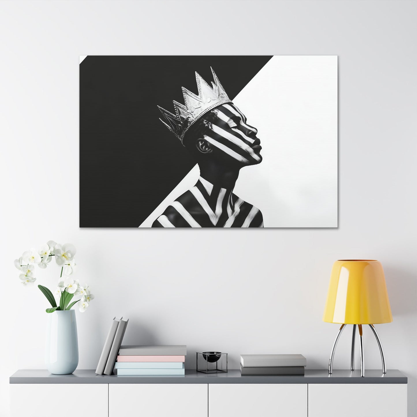 Horizontal-oriented wall art: "Crown of Dignity V" A black-and-white abstract portrait of a Black man wearing a metallic crown, his face and body adorned with bold, geometric stripes. The striking contrast and minimalist design emphasize his regal presence and dignified expression against a stark background.