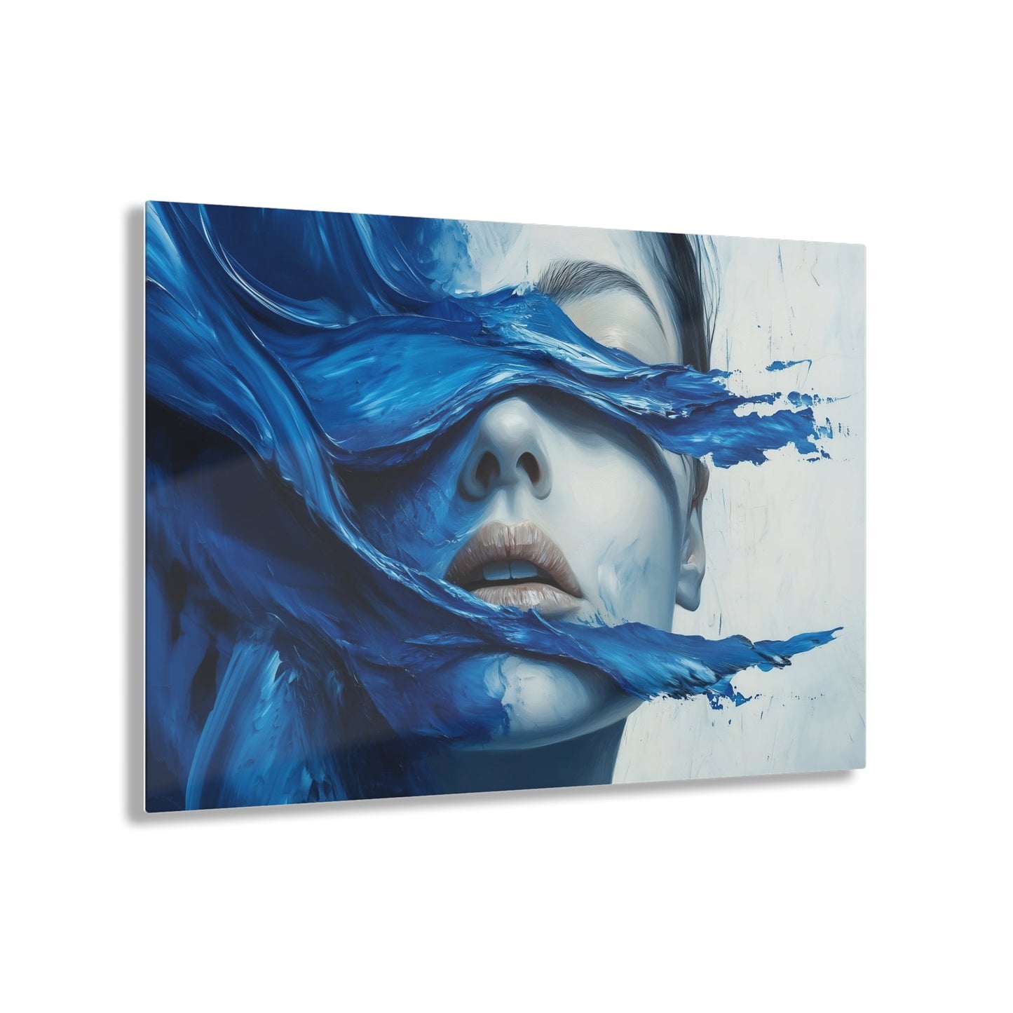 Horizontal-oriented wall art "Tides of the Mind" A surreal portrait of a woman's face partially obscured by flowing waves of cobalt blue paint. The image evokes a sense of introspection and calm, blending realistic features with abstract, fluid movement.